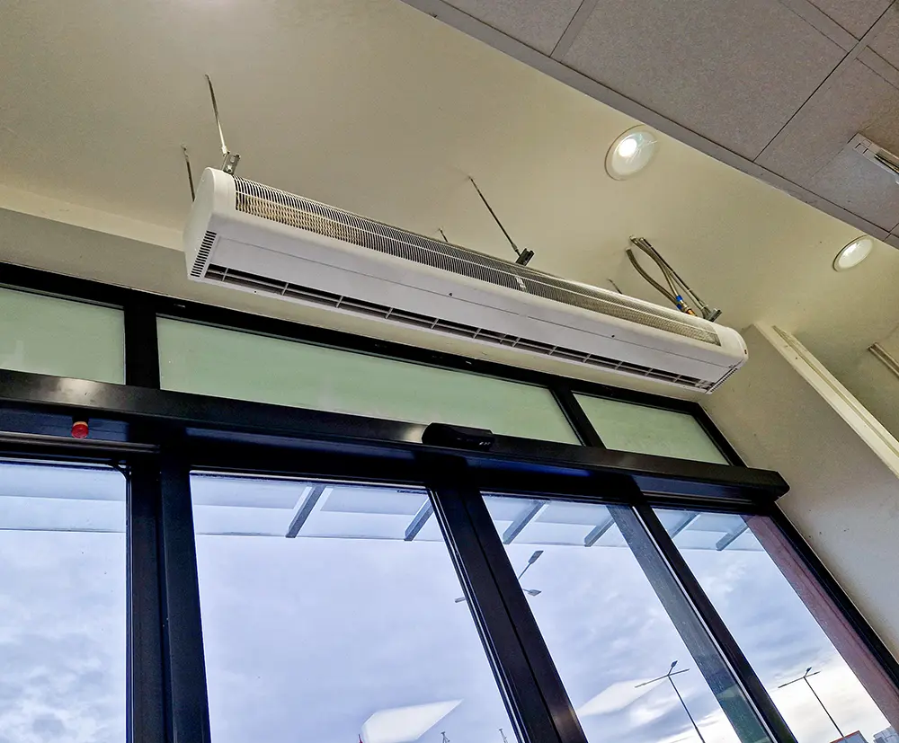 Air Curtains over door in a commercial space